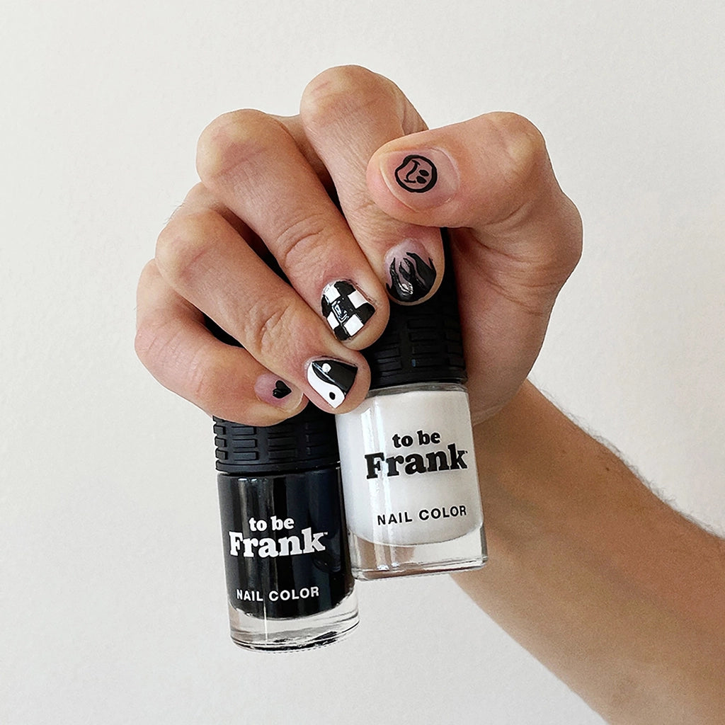 To Be Frank nail polish black and white bottles in man's hand
