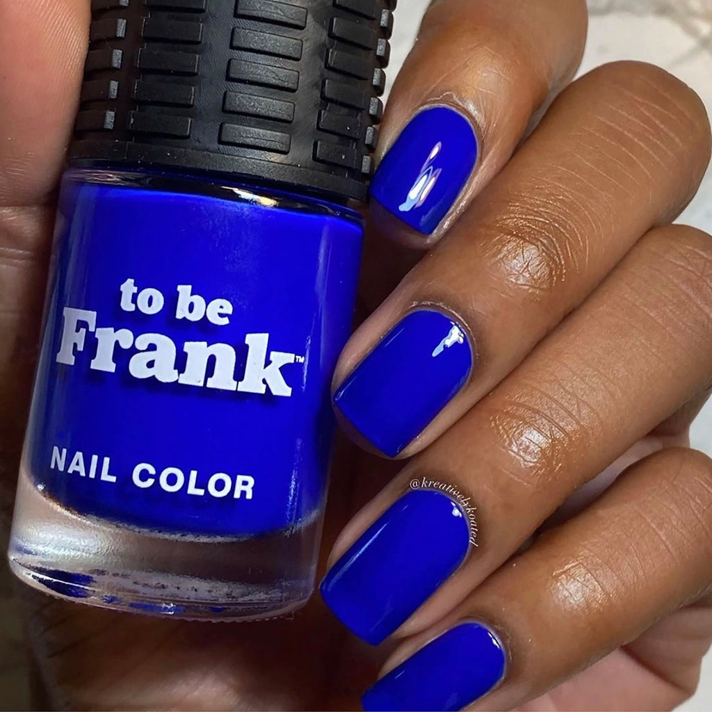 To Be Frank cobalt blue nail polish named Evil Eye painted on African American hand