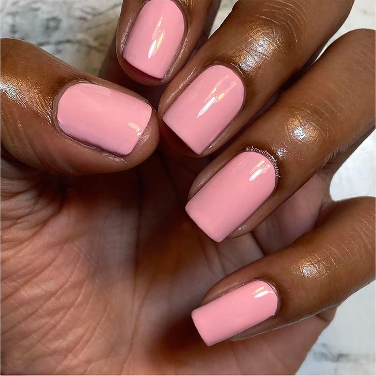 To Be Frank light pink nail polish named Gum painted on African American hand
