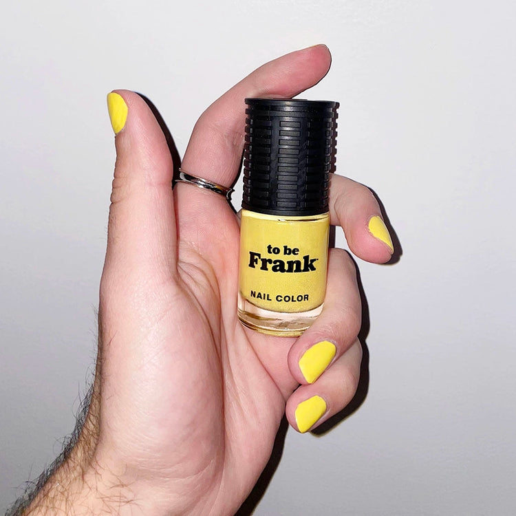 To Be Frank bright yellow nail polish named Sunny AF on man's hand